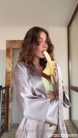 Watch OnlyFans Anna Malygon teasing in a lime green bikini and grey silk robe playing with banana